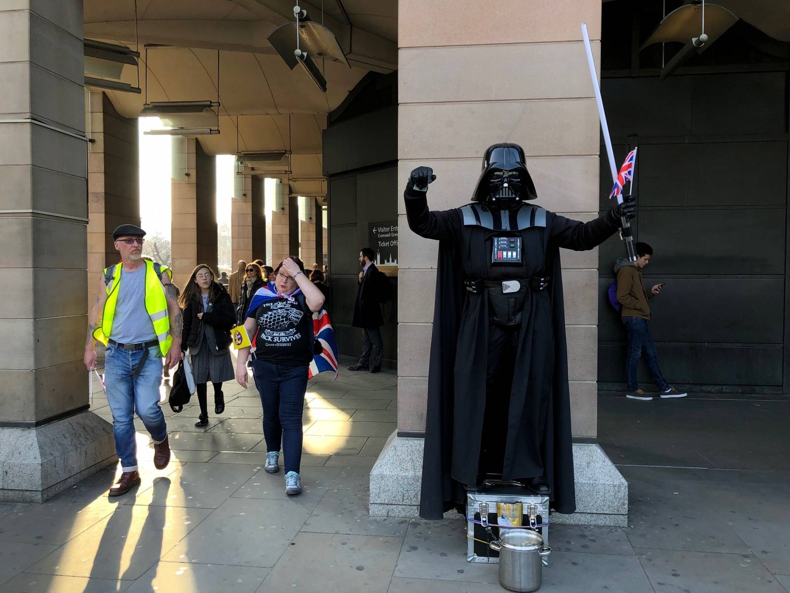 A man dressed as Darth Vader poses with a Union Jack near the pro-Brexit demonstration in Parliament Square, in London