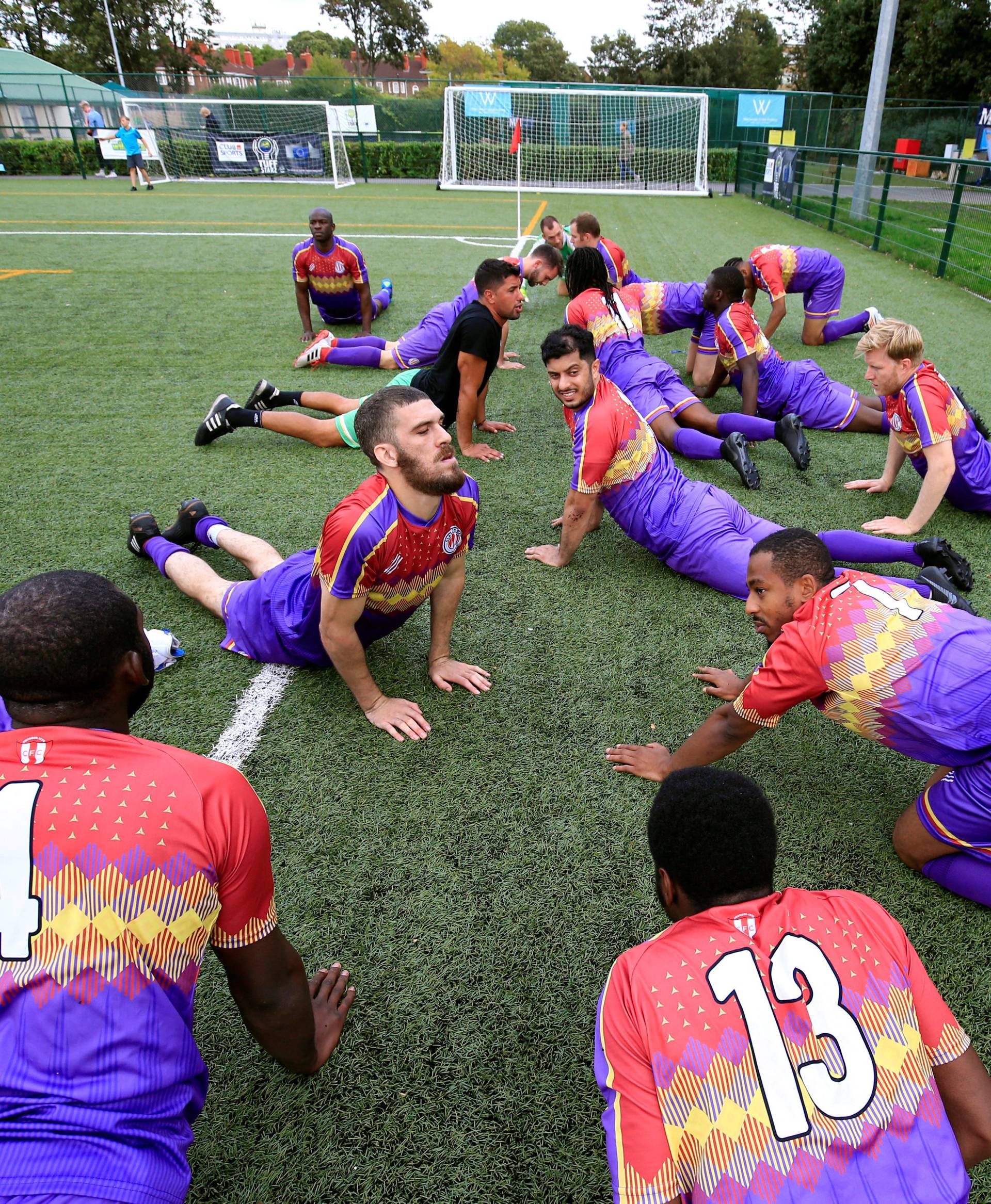 Clapton CFC players prepare for their away game with Ealing Town in East Acton, in London