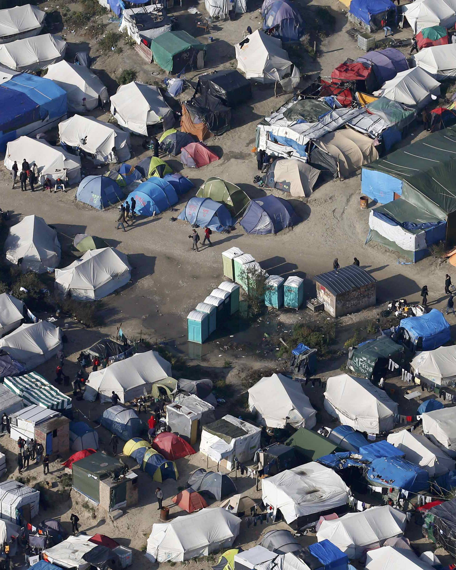 An aerial view shows tents and makeshift shelters on the eve of the evacuation and dismantlement of the camp called the "Jungle" in Calais