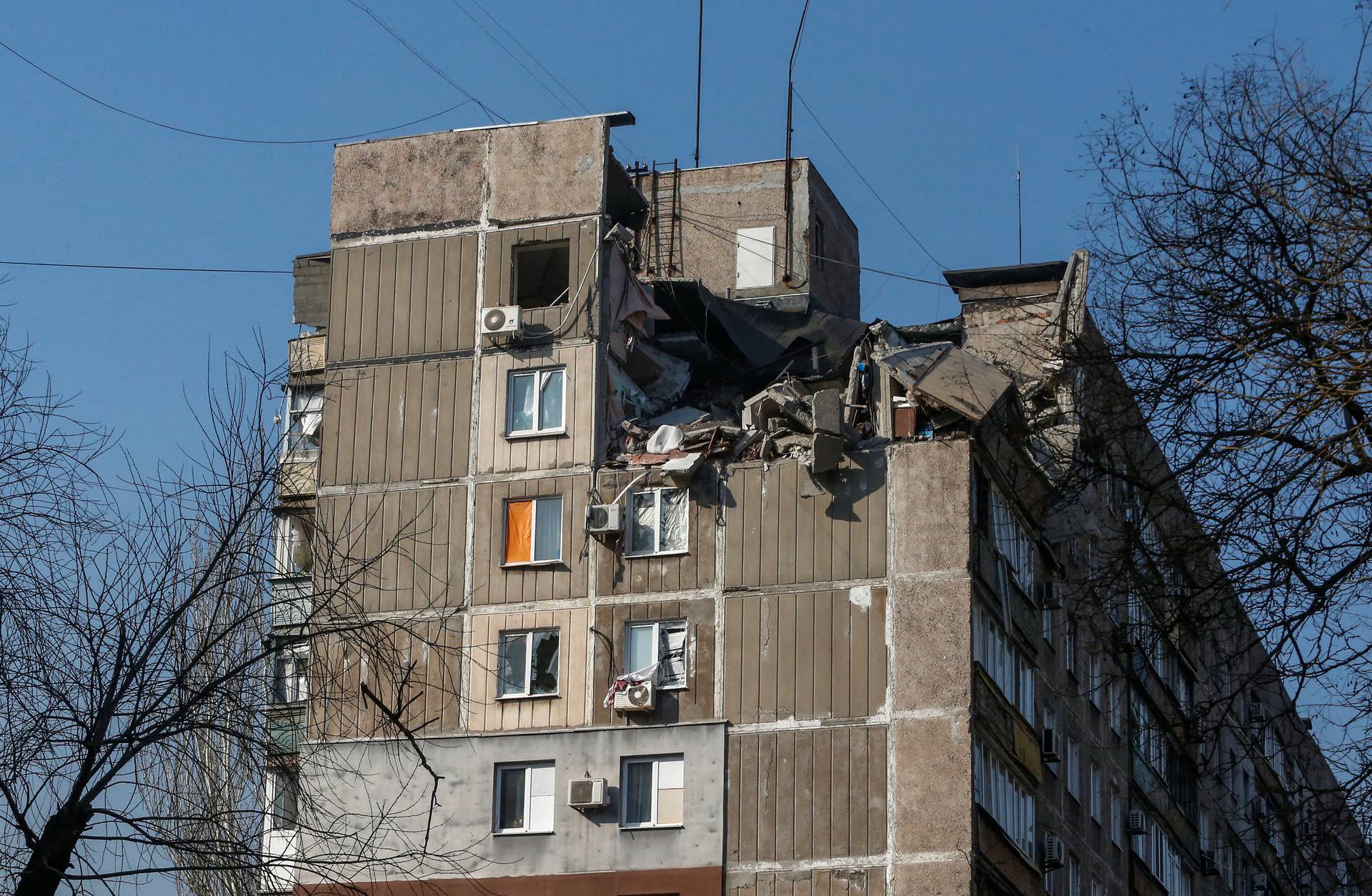 A residential building damaged in fighting during Ukraine-Russia conflict is seen in the besieged southern port of Mariupol