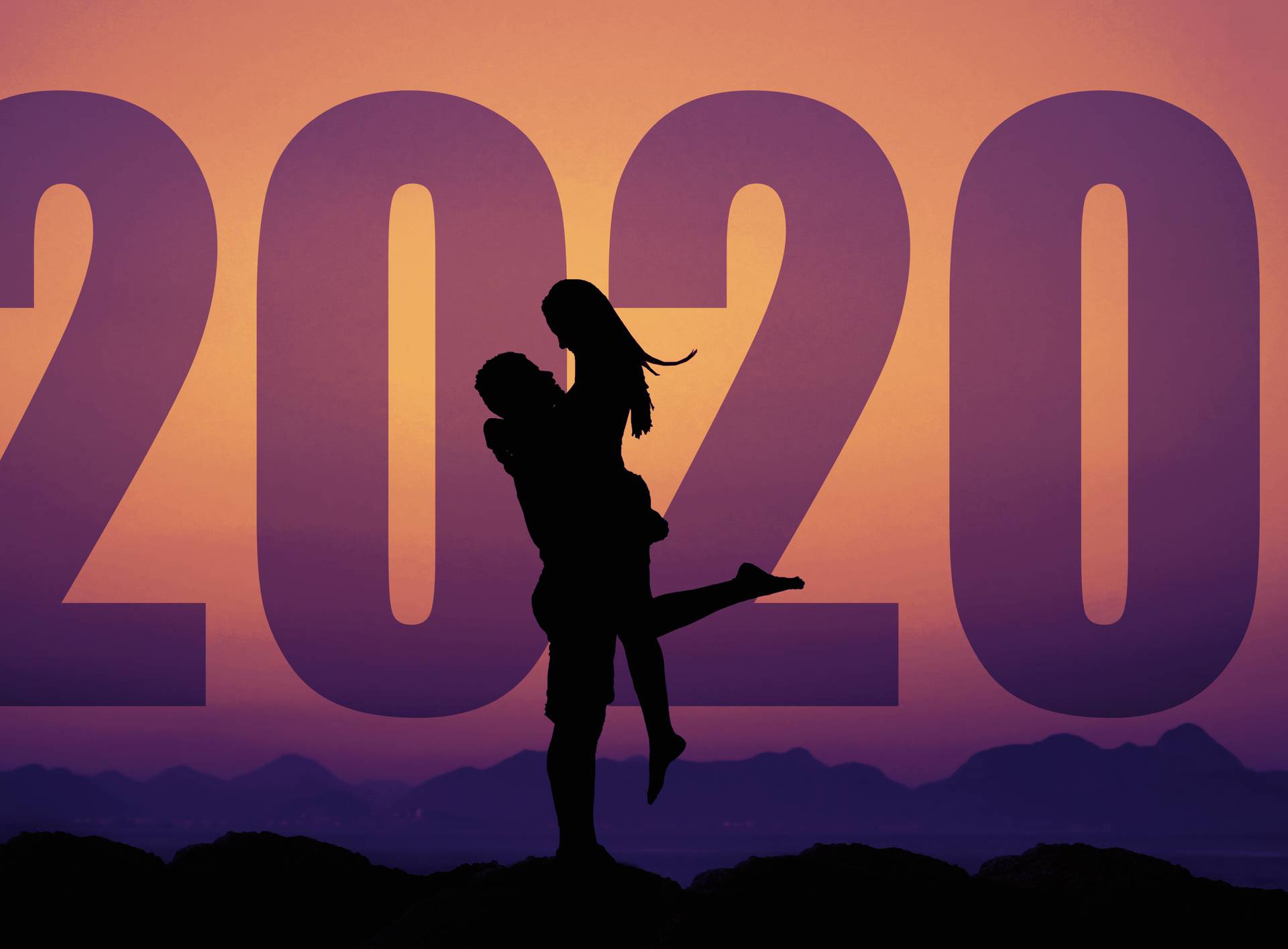 Love couple silhouette with big new year 2020 and sunset