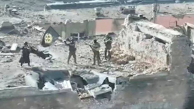 A still image taken from video apparently shows Wagner fighters on top of a building in Bakhmut