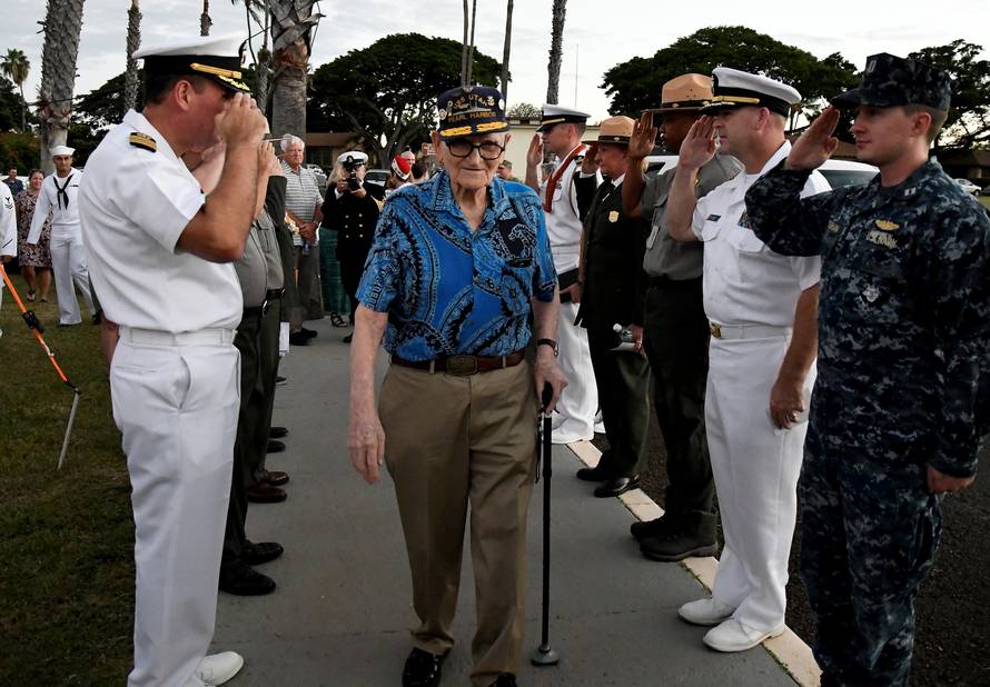 Pearl Harbor survivor Bill Hughes, who was aboard the USS Utah when it was attacked, arrives at a ceremony honoring the sailors of the USS Utah at the memorial on Ford Island at Pearl Harbor in Honolulu, Hawaii