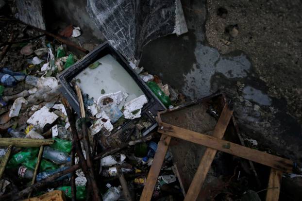 A television lies on debris after Hurricane Matthew in Les Cayes