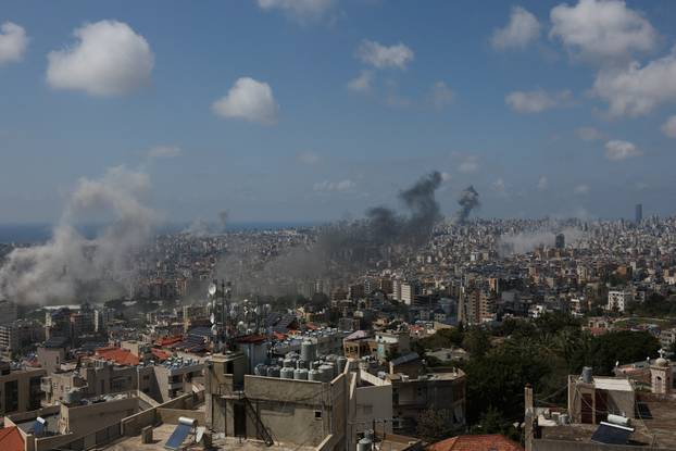 Smoke rises following an Israeli strike on the southern suburbs of Beirut