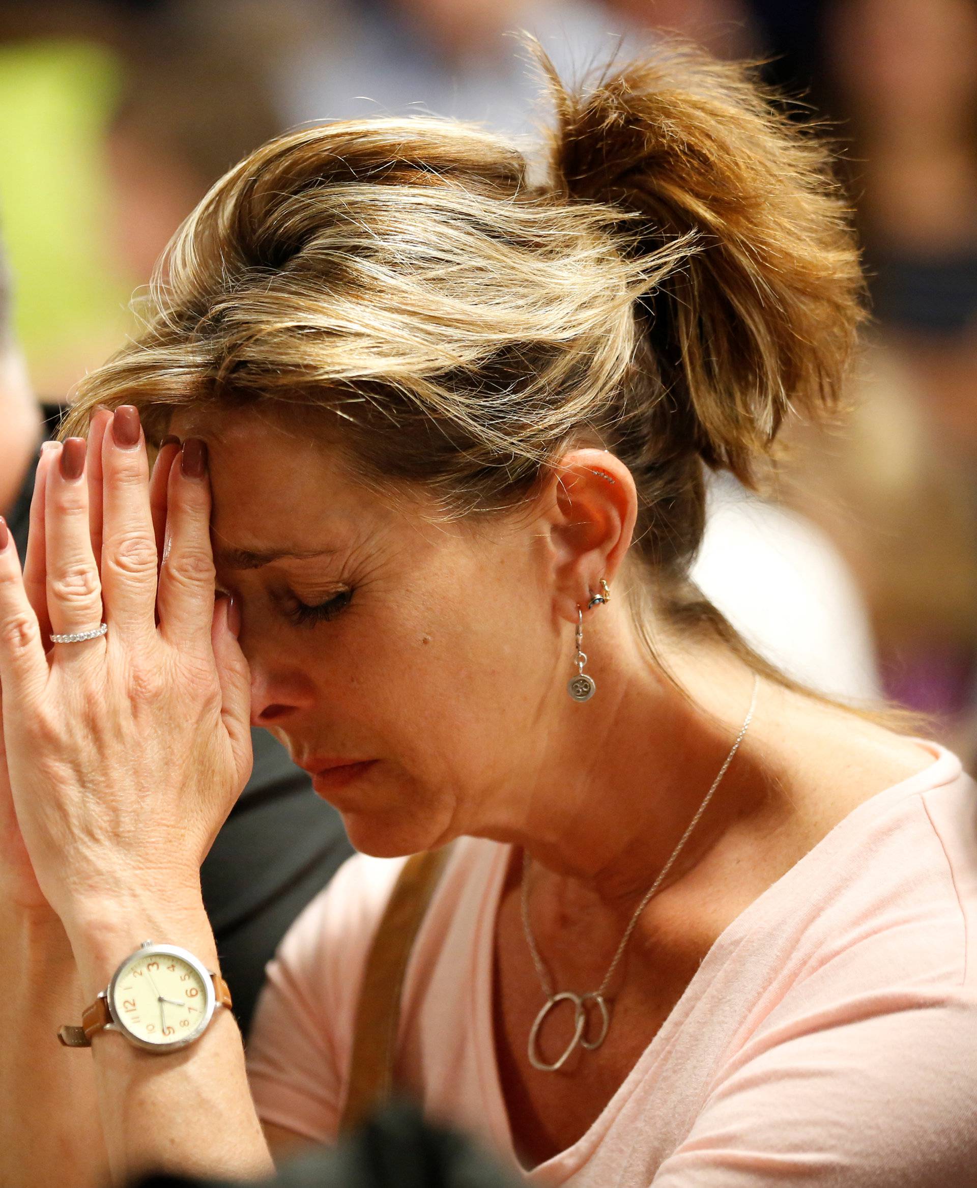 People pray during a vigil for the victims of a mass shooting in Las Vegas
