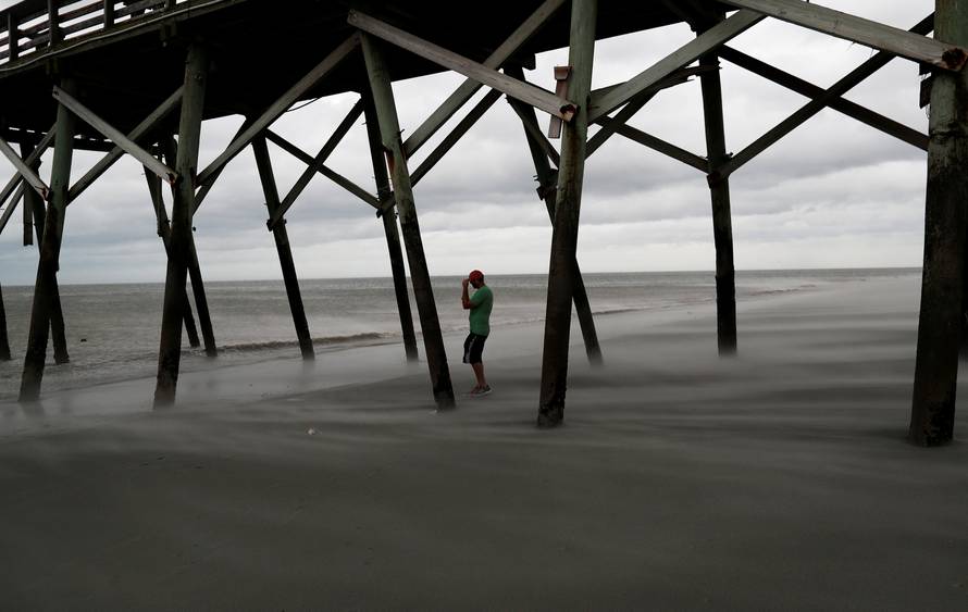 Matt Stone of Surfside Beach checks out the winds on the beach during Hurricane Florence in Surfside Beach