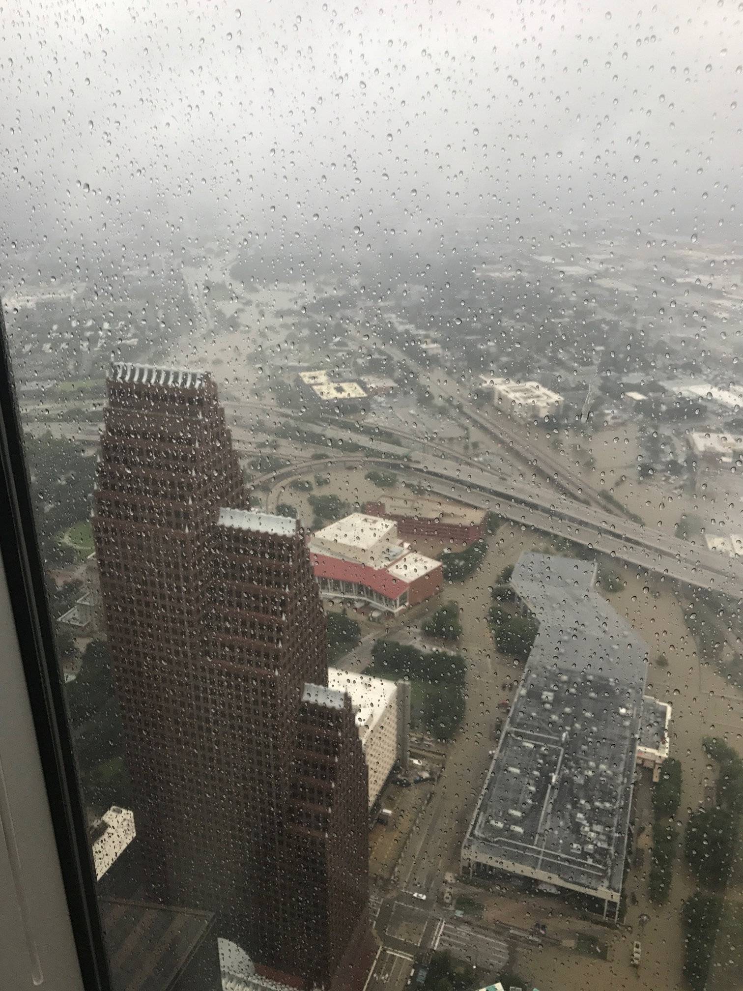 Flooded downtown is seen from JP Morgan Chase Tower after Hurricane Harvey inundated the Texas Gulf coast with rain causing widespread flooding, in Houston