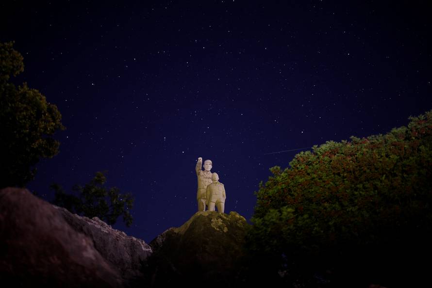 A meteor streaks past stars in the night sky during the annual Perseid meteor shower at a nature park and biosphere reserve near Malaga