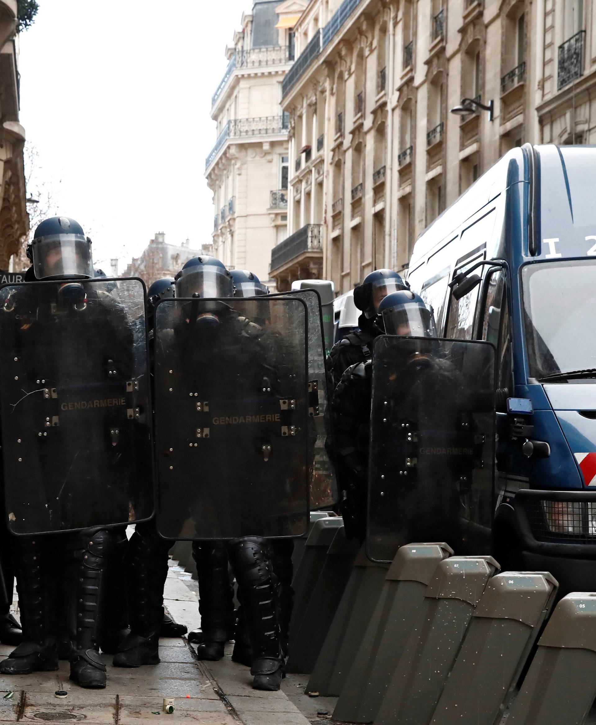 French gendarmes secure a street during a national day of protest by the "yellow vests" movement in Paris