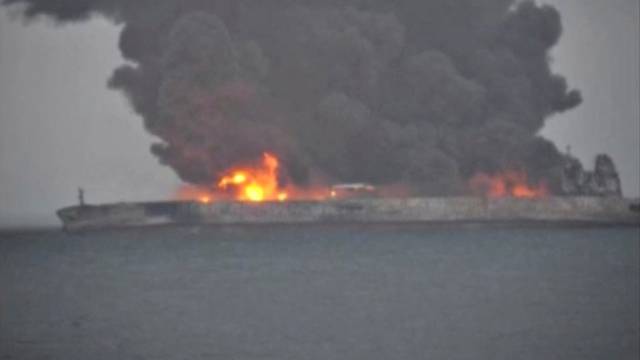 Smoke and fire is seen from Panama-registered tanker Sanchi carrying Iranian oil after it collided with a Chinese freight ship in the East China Sea