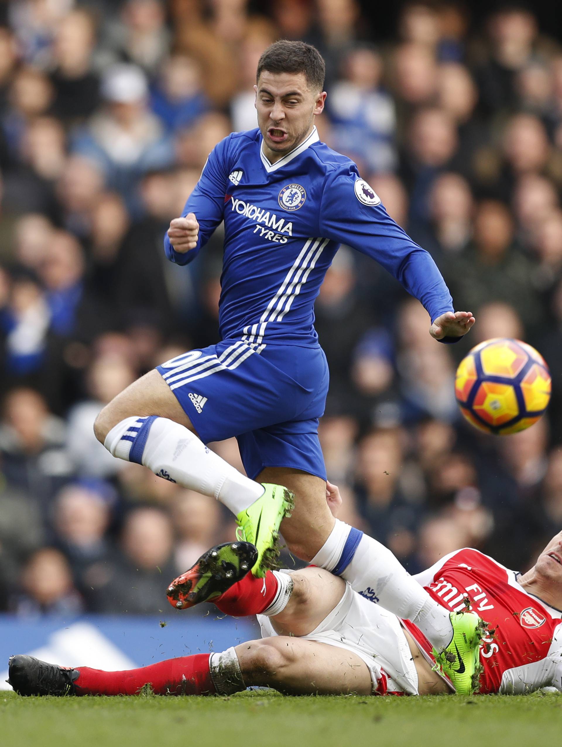 Chelsea's Eden Hazard in action with Arsenal's Laurent Koscielny
