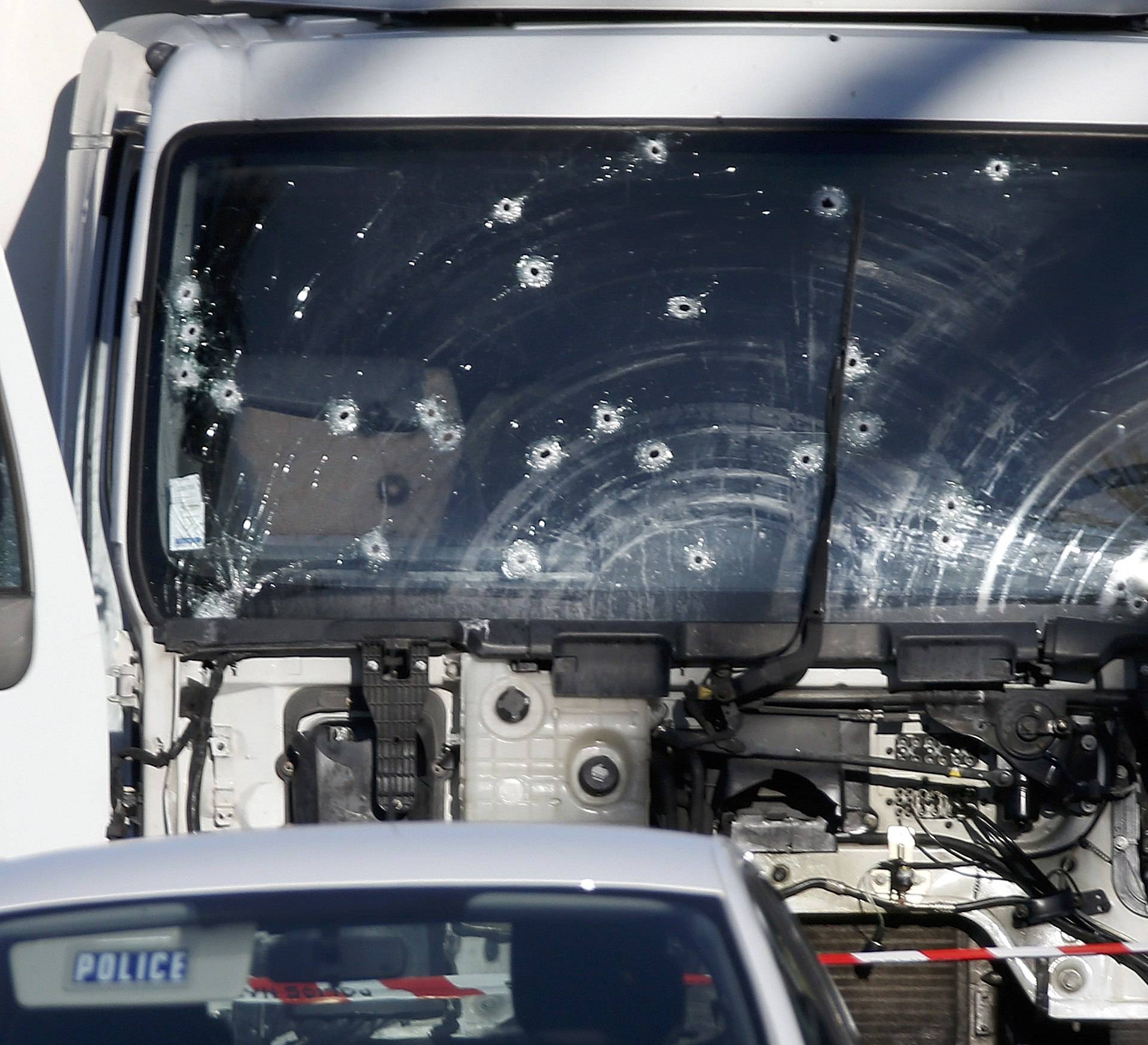 Bullet imacts are seen on the heavy truck the day after it ran into a crowd at high speed killing scores celebrating the Bastille Day July 14 national holiday on the Promenade des Anglais in Nice