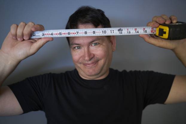 EXCLUSIVE: Jonah Falcon who has the largest penis on record at 13.5 inches (34 cm) long when erect.  Pictured is Jonah holding up items that are the same length as his 13.5 inch penis.