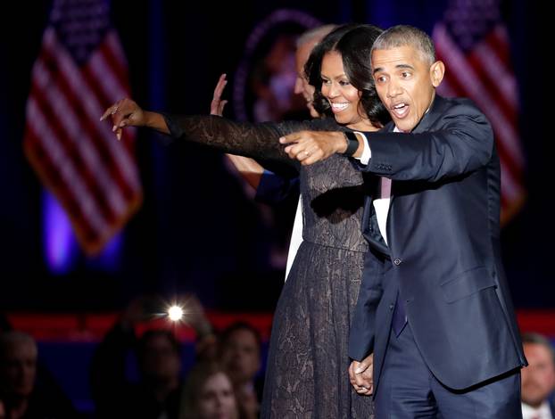 U.S. President Barack Obama and his wife Michelle acknowledge the crowd after President Obama delivered a farewell address at McCormick Place in Chicago