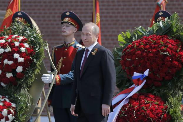 Russian President Putin attends wreath-laying ceremony to mark end of World War Two at Tomb of Unknown Soldier by Kremlin walls in Moscow