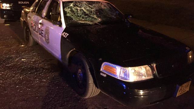 A police car with broken windows is seen in a photograph released by the Milwaukee Police Department after disturbances following the police shooting of a man in Milwaukee