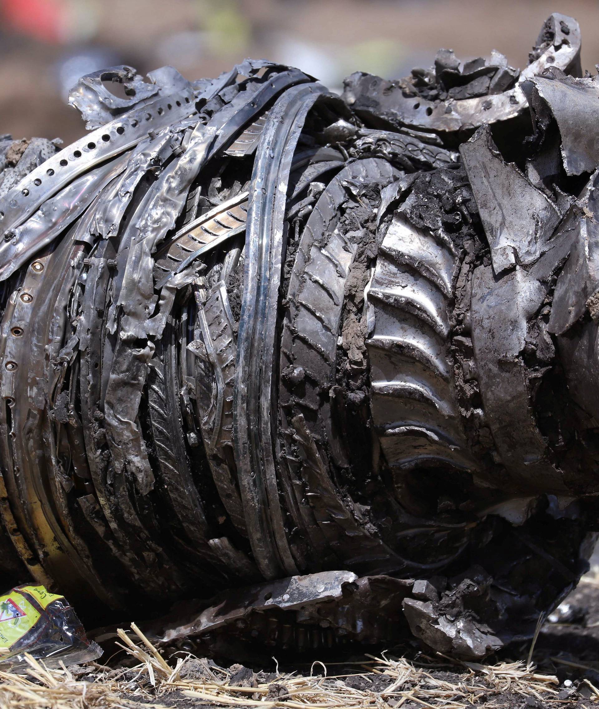Airplane engine parts are seen at the scene of the Ethiopian Airlines Flight ET 302 plane crash, near the town of Bishoftu