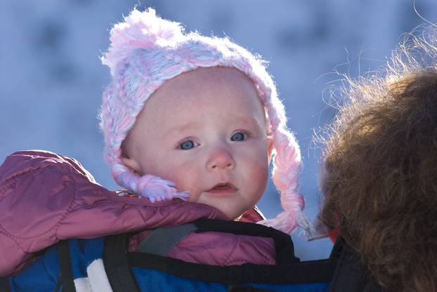 Cute Innocent Little Girl in Backpack Hiking