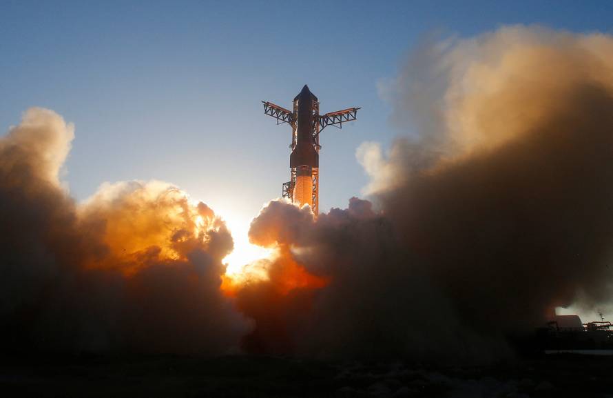 A SpaceX Super Heavy booster carrying the Starship spacecraft lifts off on its 11th test flight