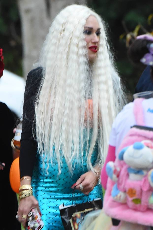 *EXCLUSIVE* Gwen Stefani dresses as a mermaid for Halloween and shows off a distinct bump in her tight outfit **NO WEB**