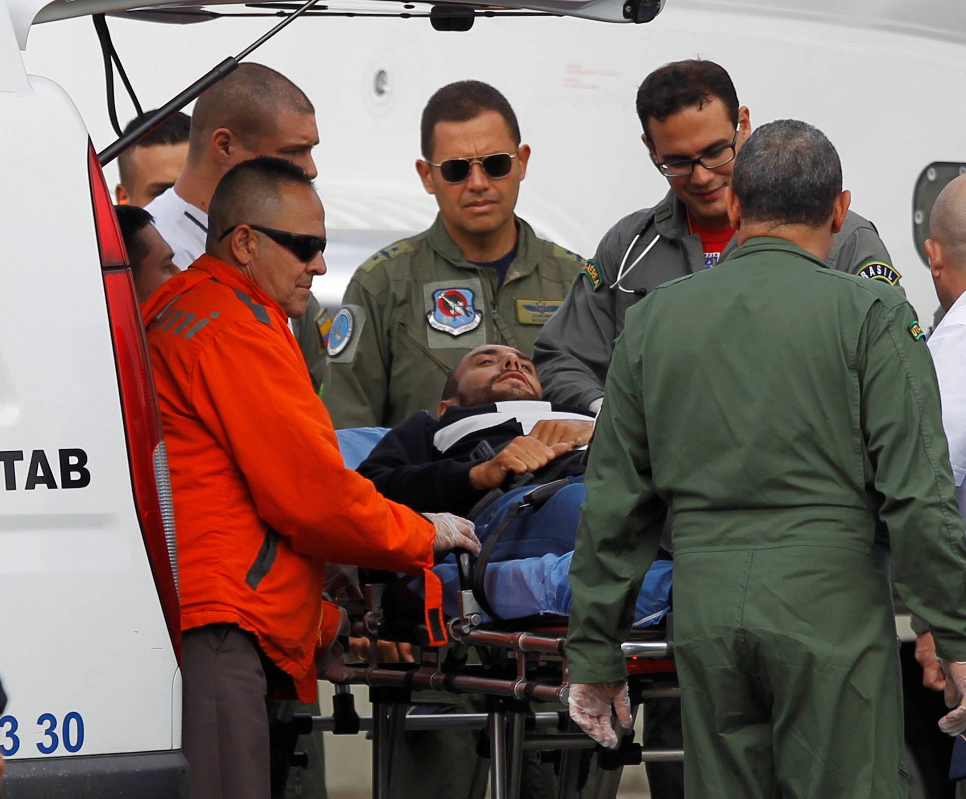 Alan Ruschel, player of Brazilian soccer team Chapecoense, lies on a stretcher before being loaded into a plane of Brazilian's Air Force for his return to Brazil, in Rionegro