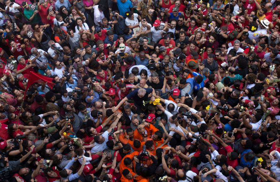 Former Brazilian President Luiz Inacio Lula da Silva is carried by supporters in front of the metallurgic trade union in Sao Bernardo do Campo