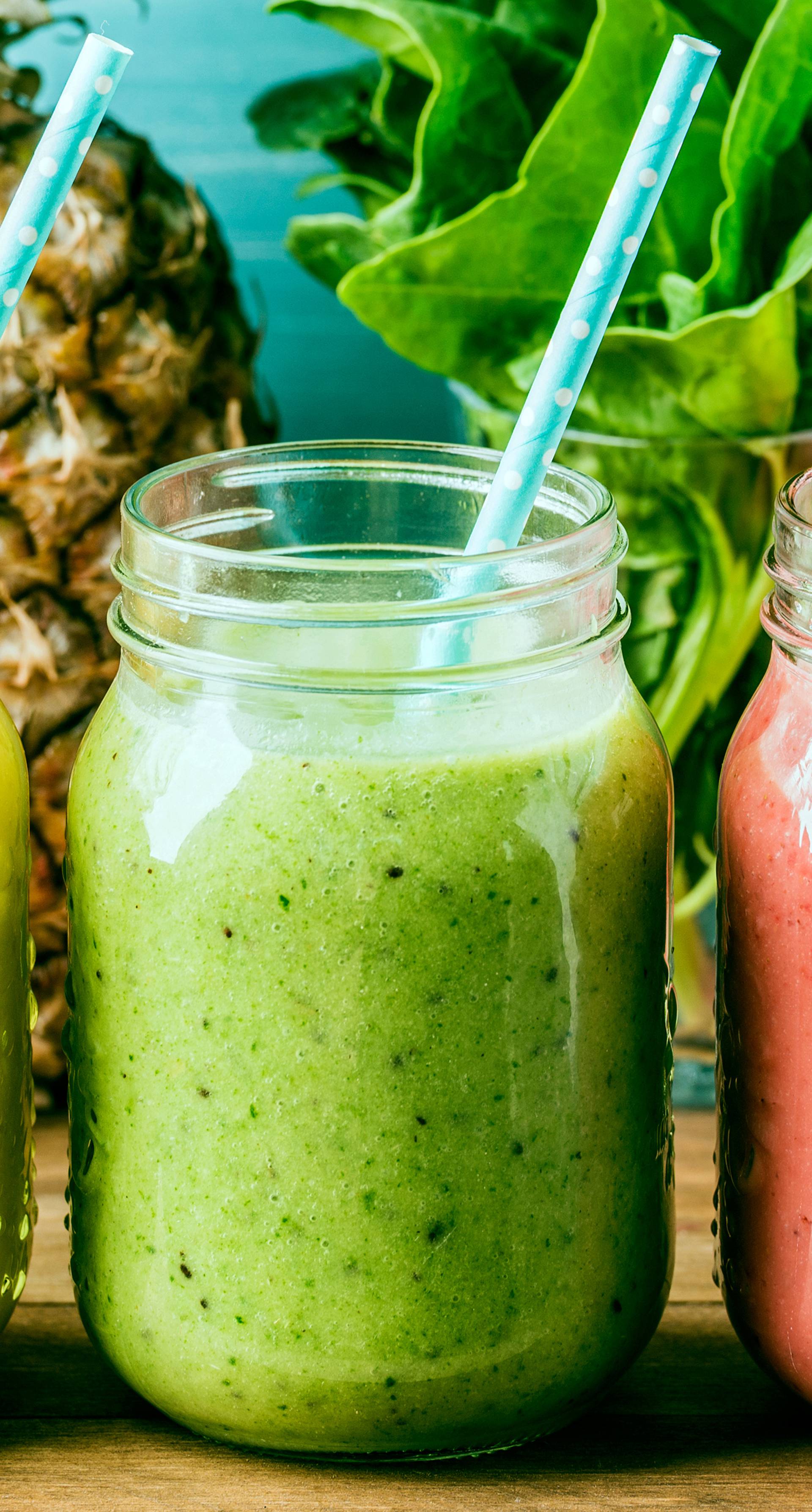 Freshly blended fruit smoothies of various colors and tastes