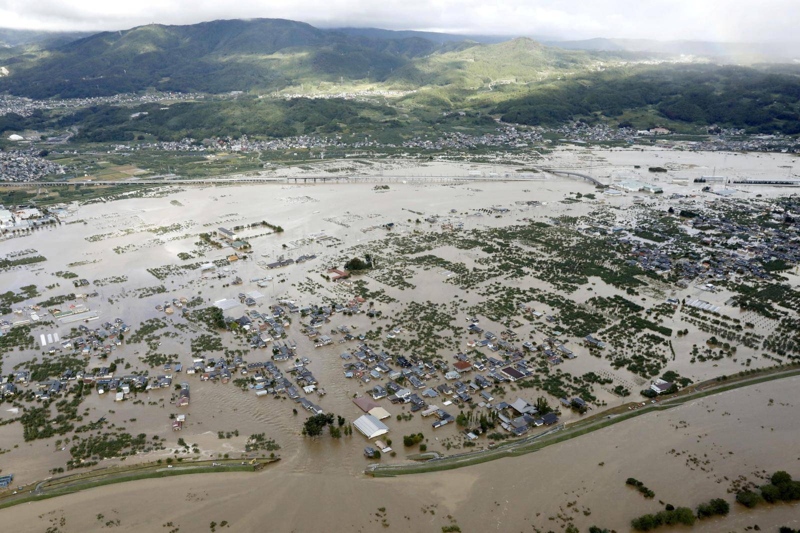An aerial view shows residential areas flooded by the Chikuma river, caused by Typhoon Hagibis in Nagano, central Japan