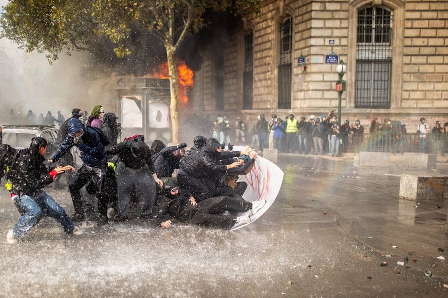 Police clash with protesters during demonstration in Paris