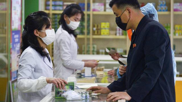 A man visits a pharmacy, amid growing fears over the spread of the coronavirus disease (COVID-19), in Pyongyang