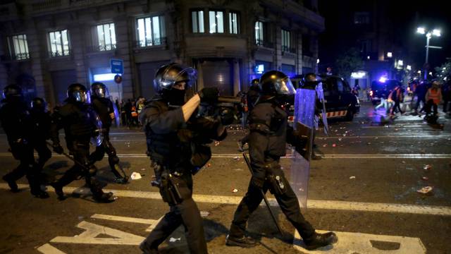 Police charge against protesters in the streets of Barcelona