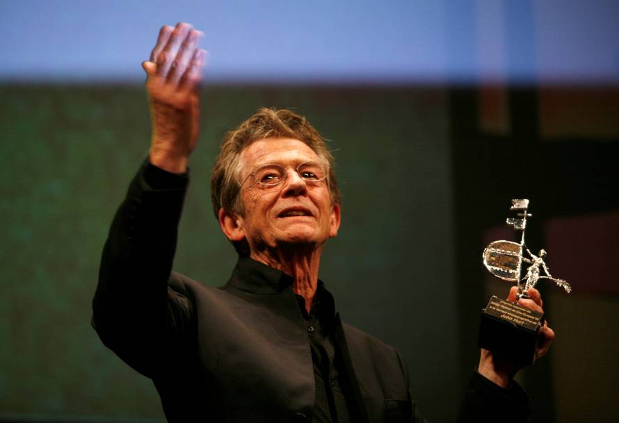 FILE PHOTO: British actor John Hurt holds the Gold Giraldillo Award as a tribute to his career during Sevilla European film festival in Seville