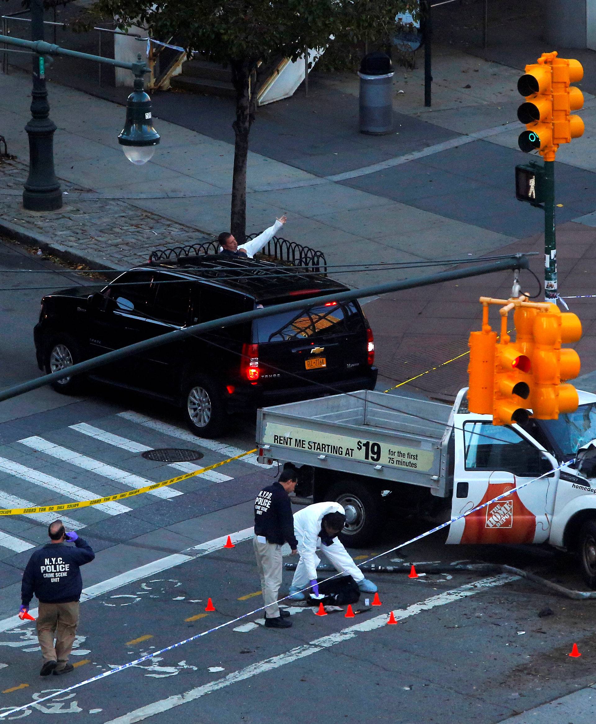 Police investigate a vehicle allegedly used in a ramming incident on the West Side Highway in Manhattan, New York.