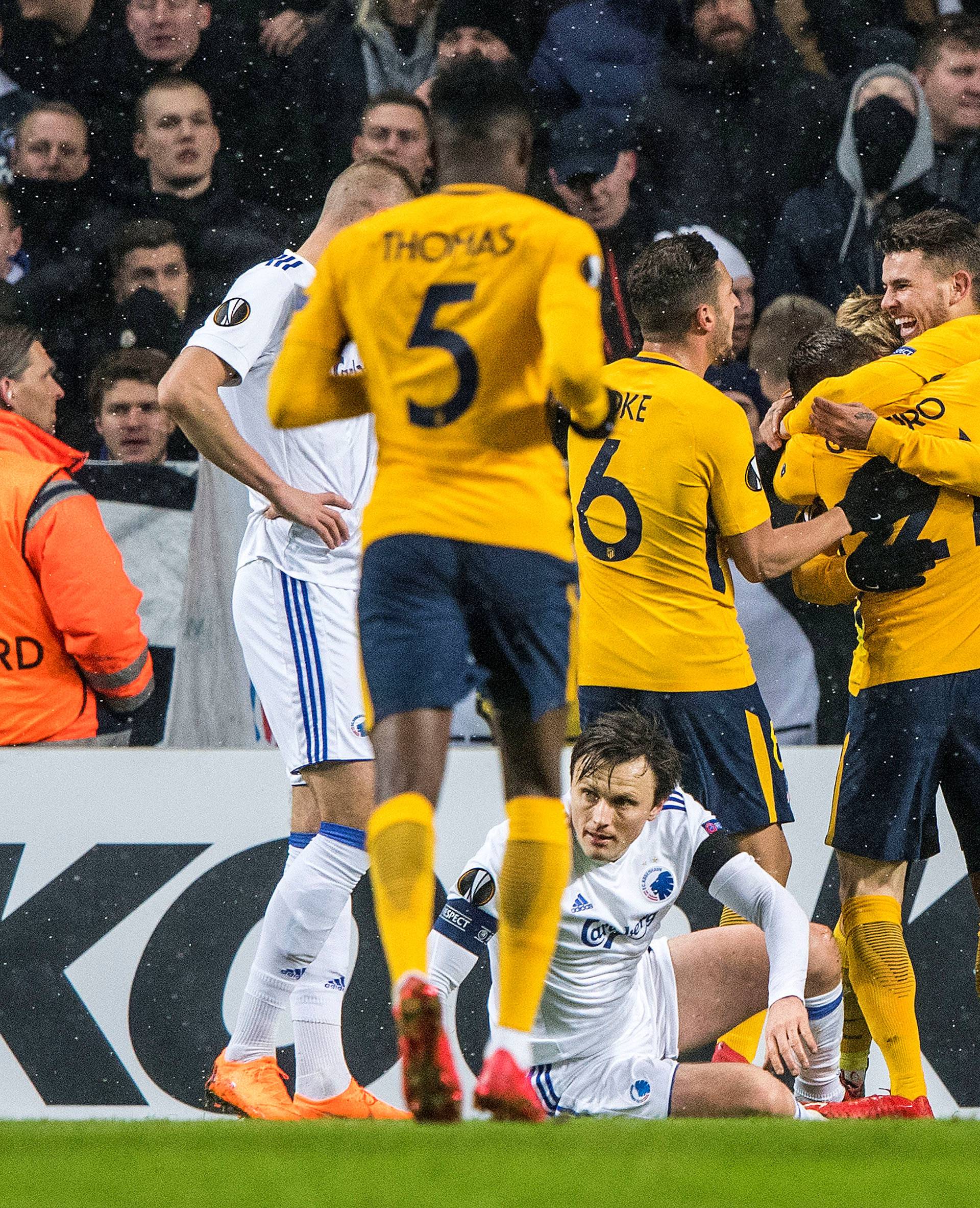 Atletico Madrid players celebrate after scoring against FC Copenhagen during the football match between FC Copenhagen and Atletico Madrid in Copenhagen