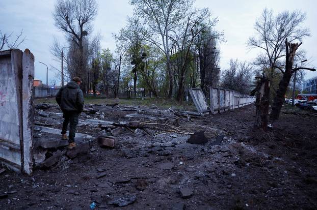 Rescuers work at the site of a Russian missile strike, amid Russia's attack on Ukraine, in Kyiv