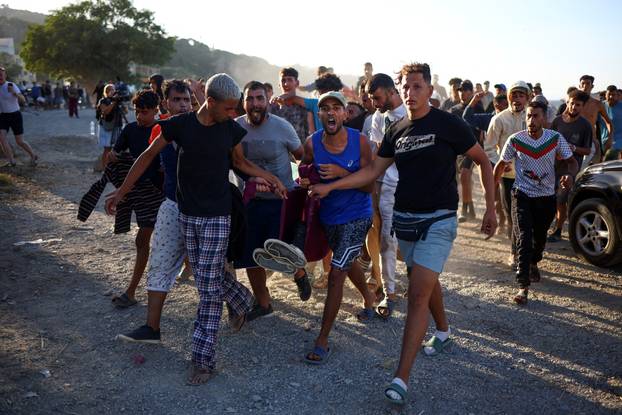 Mass crossings of migrants on foot and by sea from Morocco into Spanish territory, in Ceuta