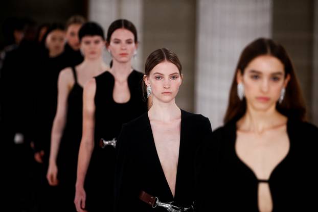 Models present creations at the Victoria Beckham catwalk show during London Fashion Week in London