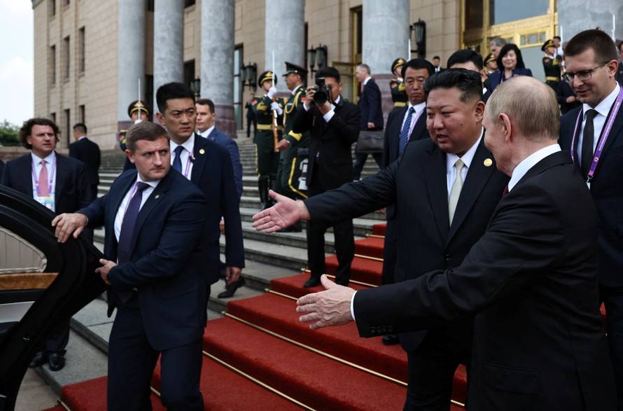 Russian President Vladimir Putin meets with North Korean leader Kim Jong Un in Beijing