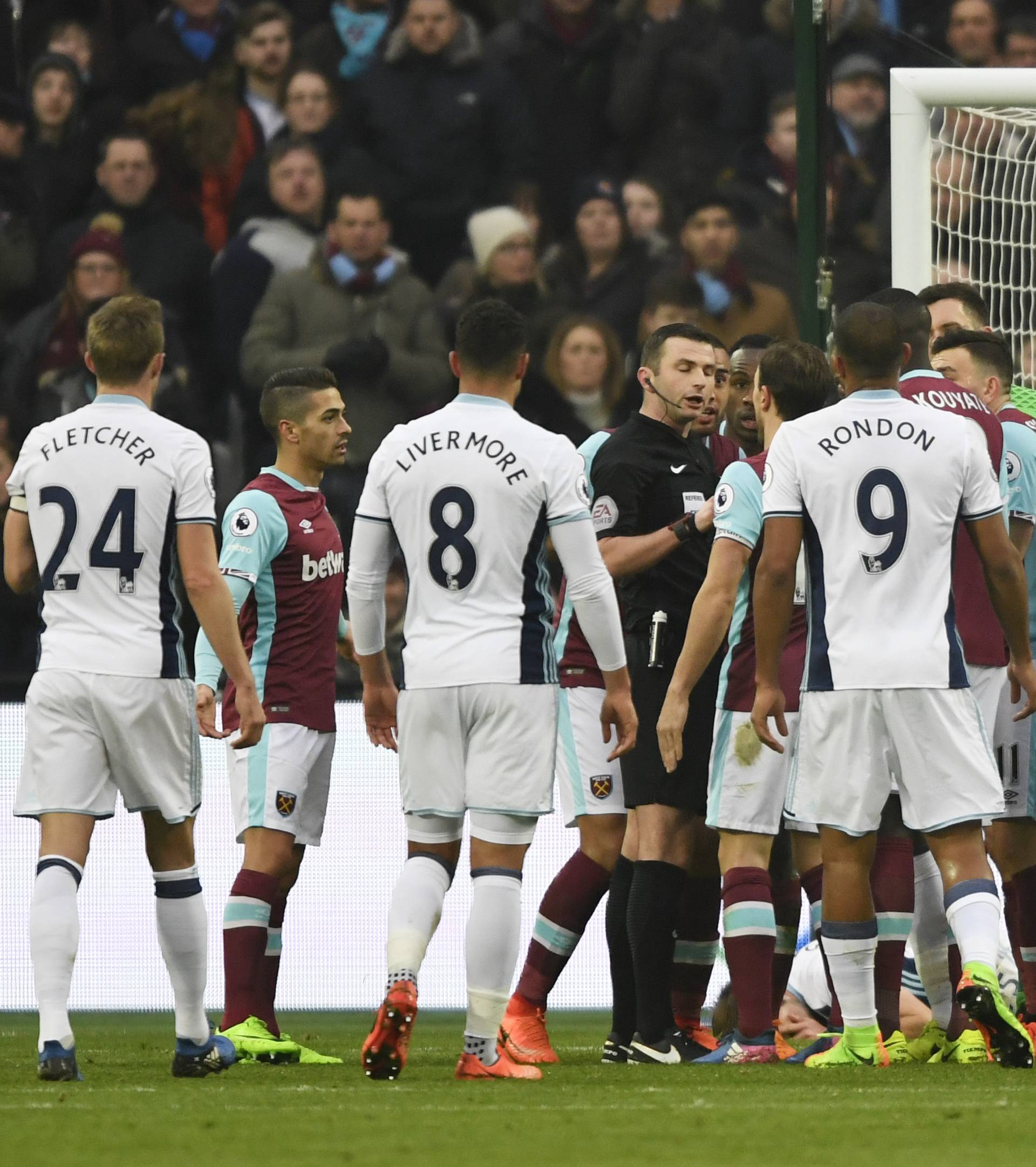 West Ham players remonstrate with the referee Michael Oliver after a disallowed goal