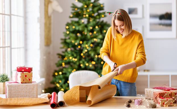 Happy,Young,Woman,Gets,Ready,For,Christmas,And,Wrapping,A