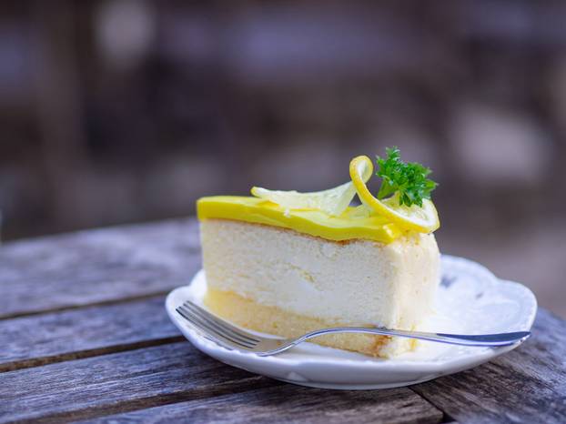 Lemon cake on wooden table.