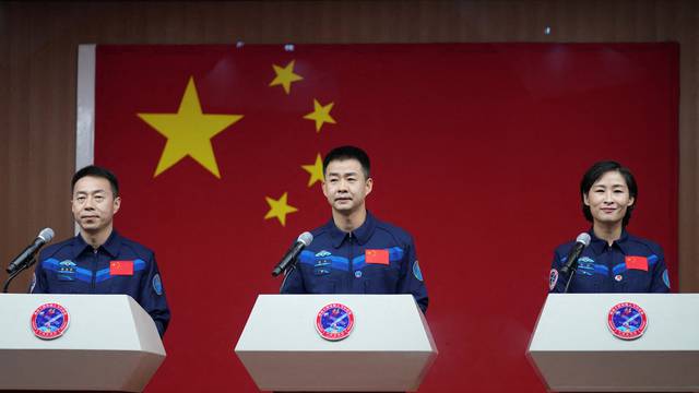 Chinese astronauts Chen Dong, Liu Yang and Cai Xuzhe attend a news conference before the Shenzhou-14 spaceflight mission, at Jiuquan Satellite Launch Center