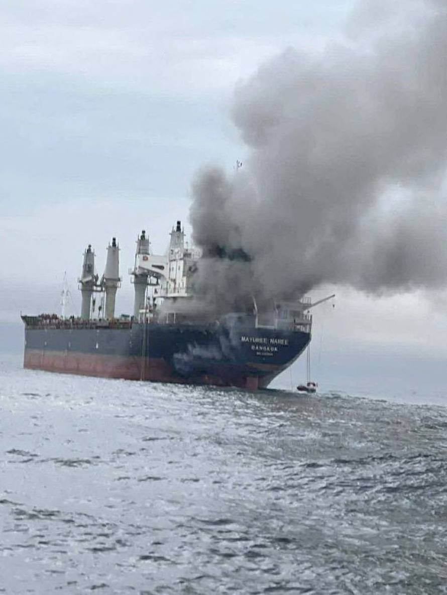The Thailand-flagged cargo ship Mayuree Naree engulfed in black smoke in the Strait of Hormuz