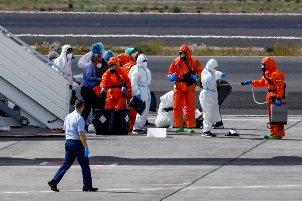 Passengers of the cruise ship MV Hondius, which was affected by a hantavirus outbreak, arrive at Tenerife Sud airport