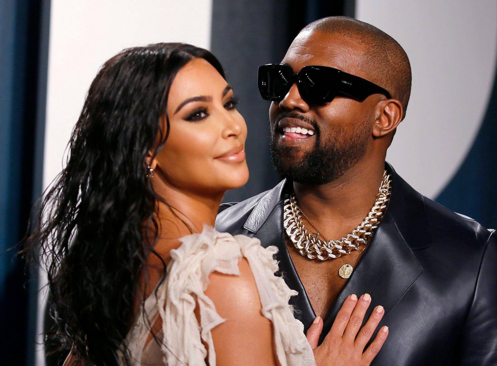 FILE PHOTO: Kim Kardashian and Kanye West attend a Vanity Fair Oscar party in Beverly Hills