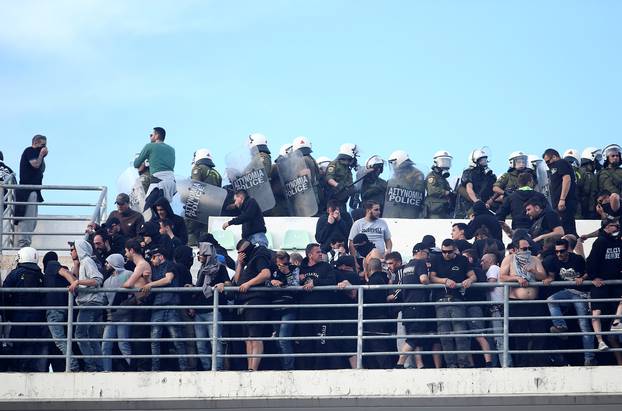 Riot police arrive to push back fans of PAOK Salonika as they clash with fans of AEK Athens before the Greek Cup Final soccer game at Panthessaliko stadium in Volos