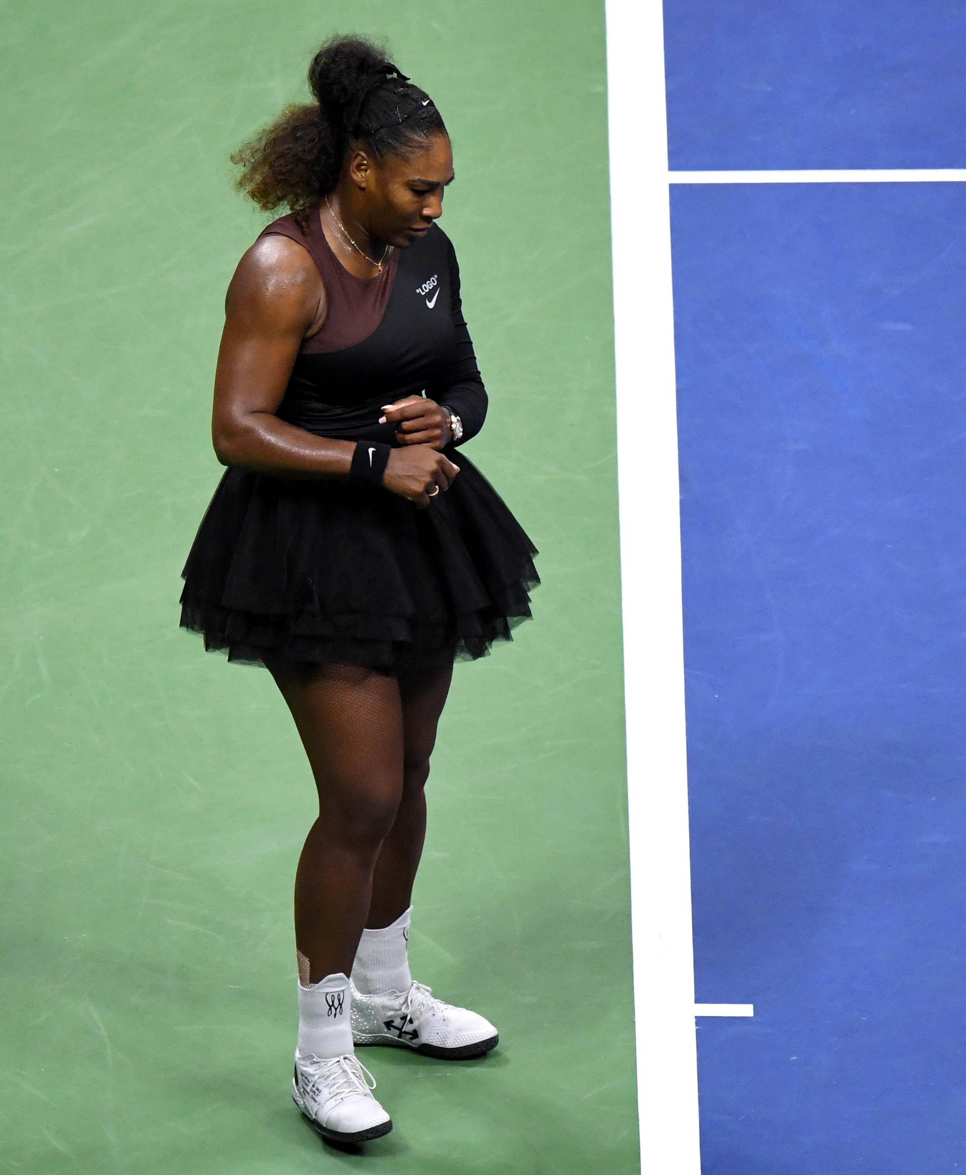 FILE PHOTO: Serena Williams of the United States smashes her racket on day thirteen of the 2018 U.S. Open tennis tournament in New York