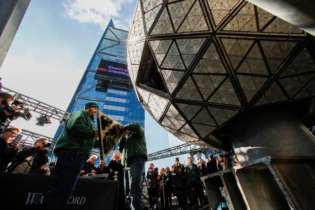 Workers get ready to install Waterford Crystal triangles on the Times Square New Year