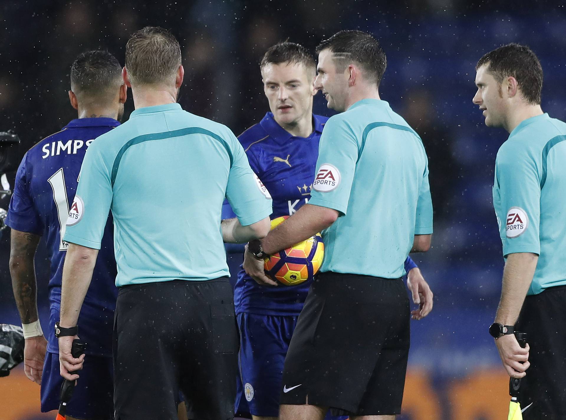 Leicester City's Jamie Vardy collets the match ball from the referee Michael Oliver at the end of the match after scoring a hat-trick
